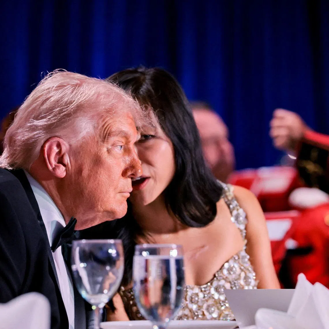FILE PHOTO: U.S. President Donald Trump listens to CBS News senior White House correspondent Weijia Jiang during the annual White House Correspondents' Association dinner in Washington, D.C., U.S., April 25, 2026. REUTERS/Jonathan Ernst/File Photo
