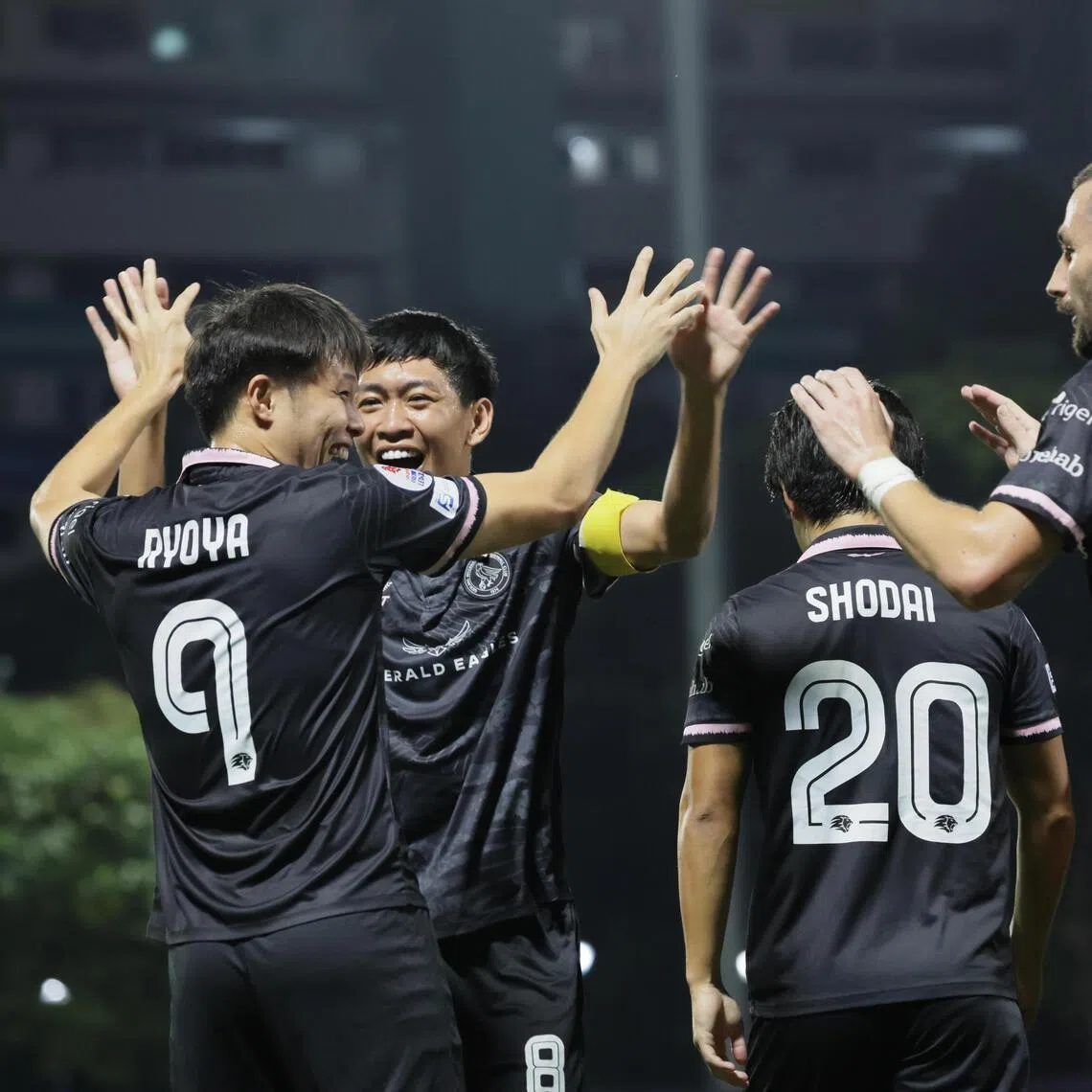 Ryoya Taniguchi (No. 9) celebrating with Geylang International teammates after scoring the opening goal in the 3-1 Singapore Premier League defeat of Tanjong Pagar United at the Jurong East Stadium on Feb 6.