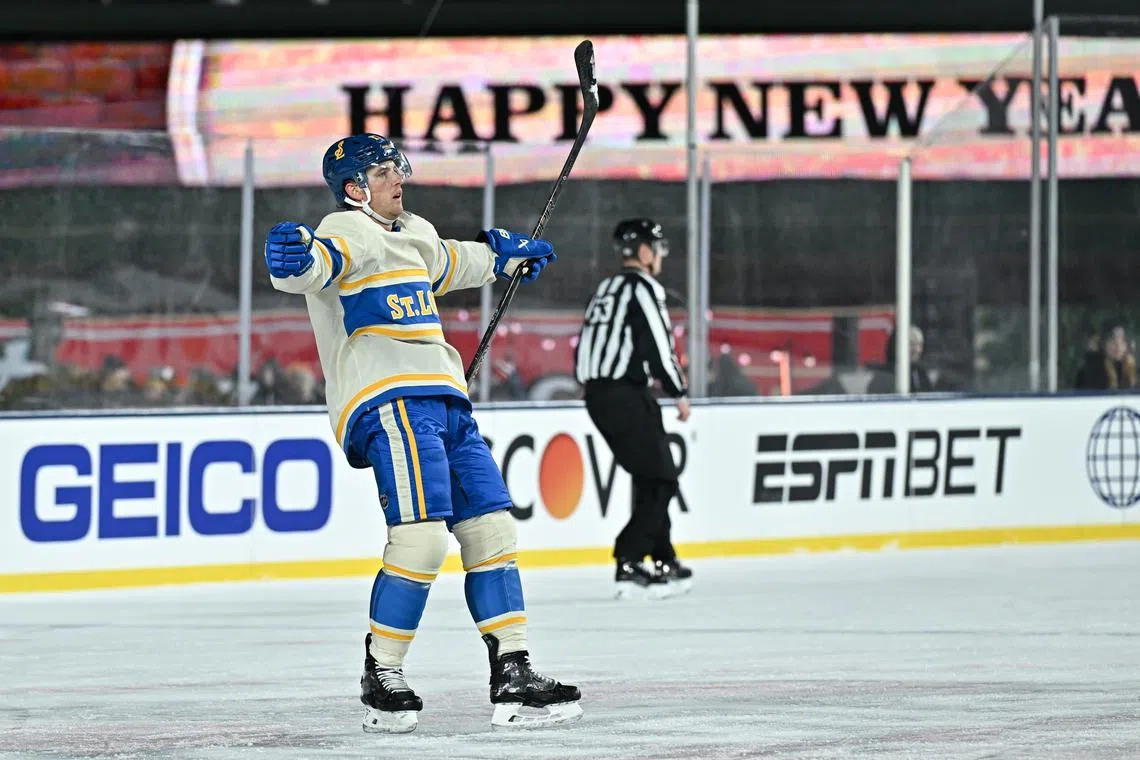 Dec 31, 2024; Chicago, Illinois, USA; St. Louis Blues defenseman Cam Fowler (17) celebrates after his goal against the Chicago Blackhawks during the second period in the Winter Classic at Wrigley Field. Mandatory Credit: Daniel Bartel-Imagn Images