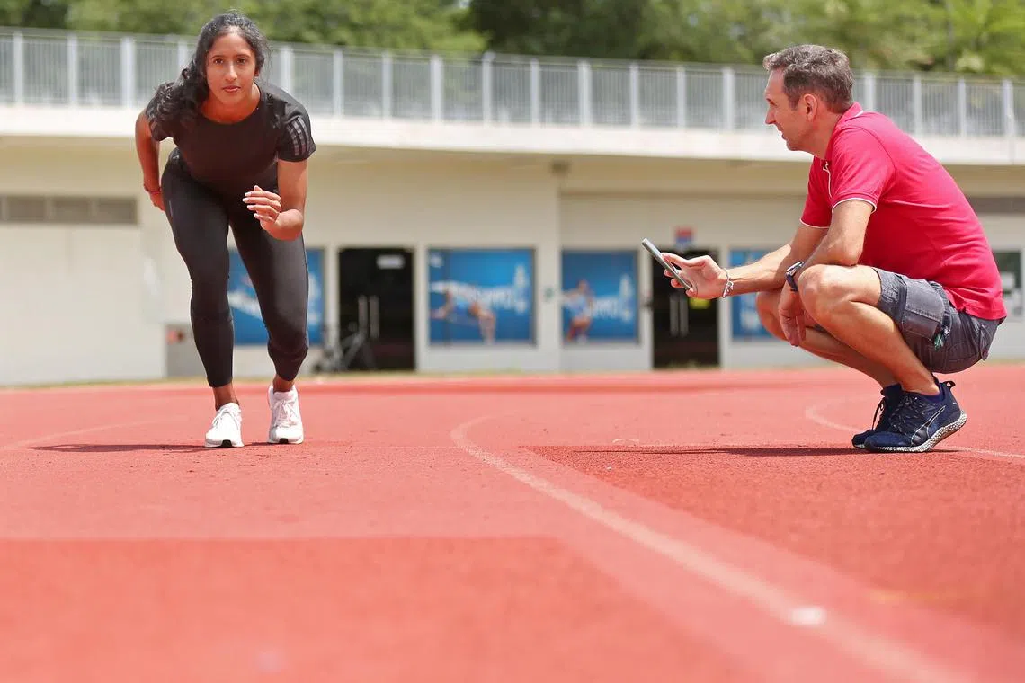 Luis Cunha guides Shanti Pereira through a recovery session at Kallang Practice Track on 4 March 2020. Luis is Shanti's new coach. 