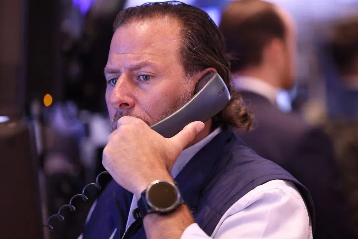 Traders work on the floor of the New York Stock Exchange, in New York City. 