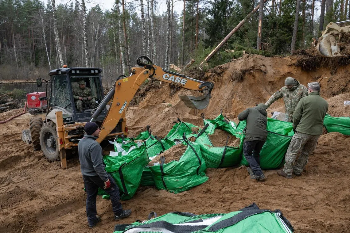 The soldiers' vehicle sank into a peat bog at a military training ground near the border with Belarus.