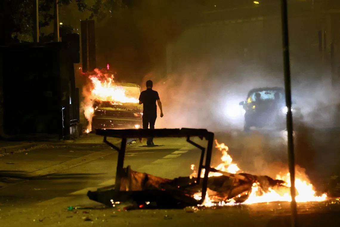 Over 800 people were arrested over Thursday night after protesters burned 2,000 cars, damaged nearly 500 buildings, looted stores and clashed with riot police officers in dozens of cities around France.