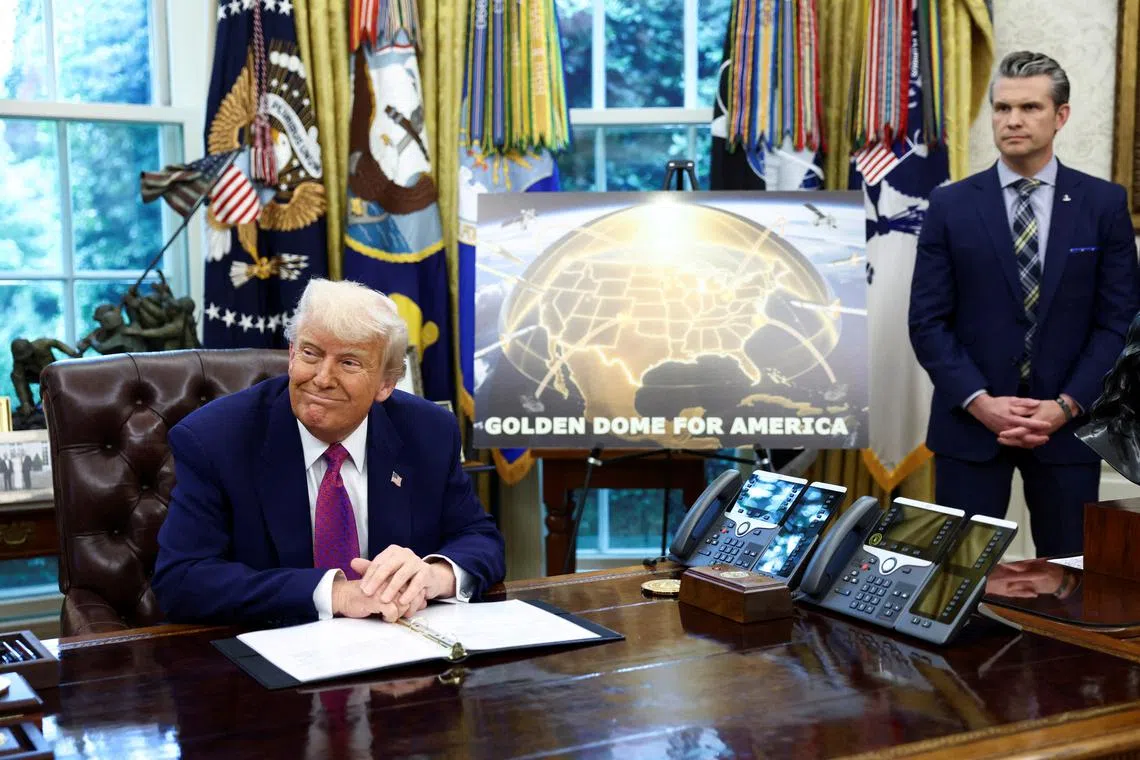U.S. President Donald Trump makes an announcement regarding the Golden Dome missile defense shield next to U.S. Defense Secretary Pete Hegseth in the Oval Office of the White House in Washington, D.C., U.S., May 20, 2025. REUTERS/Kevin Lamarque/File Photo