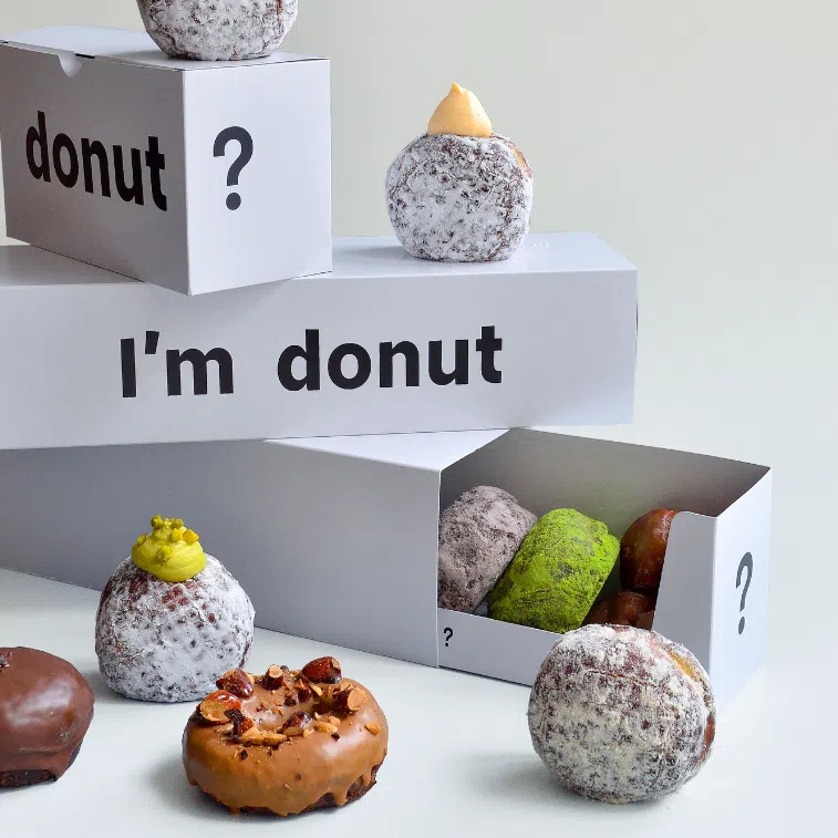 i’m donut?’s hoarding at Ion Orchard (right). The brand has gained a cult following for its nama (“fresh” or “raw” in Japanese) doughnuts.