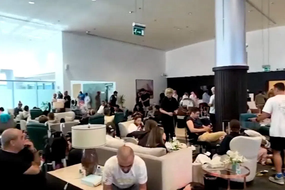 Passengers at Saudi Arabia’s Tabuk airport after a flydubai aircraft bound for Israel was diverted there on Sept 30, due to a cockpit brawl in which the pilot was stabbed.