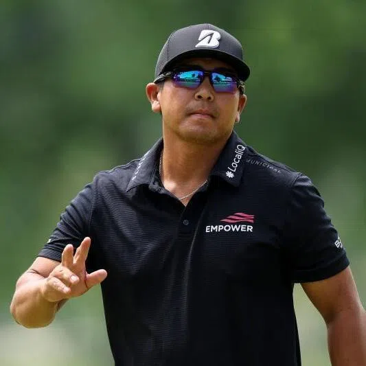 Kurt Kitayama acknowledges the crowd on the 18th green during the final round of the PGA Championship at Aronimink Golf Club on May 17, 2026 in Newtown, Pennsylvania.