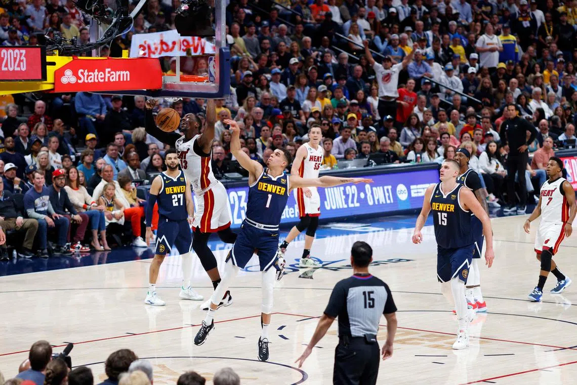 Bam Adebayo of the Miami Heat dunking during the fourth quarter against the Denver Nuggets in Game Two of the 2023 NBA Finals at Ball Arena.