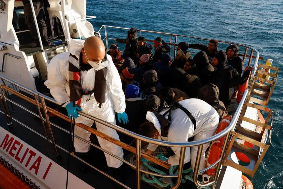 Migrants rescued by a merchant vessel wait to disembark from a Malta Armed Forces patrol boat outside Marsaxlokk, Malta April 17, 2023. REUTERS/Darrin Zammit Lupi