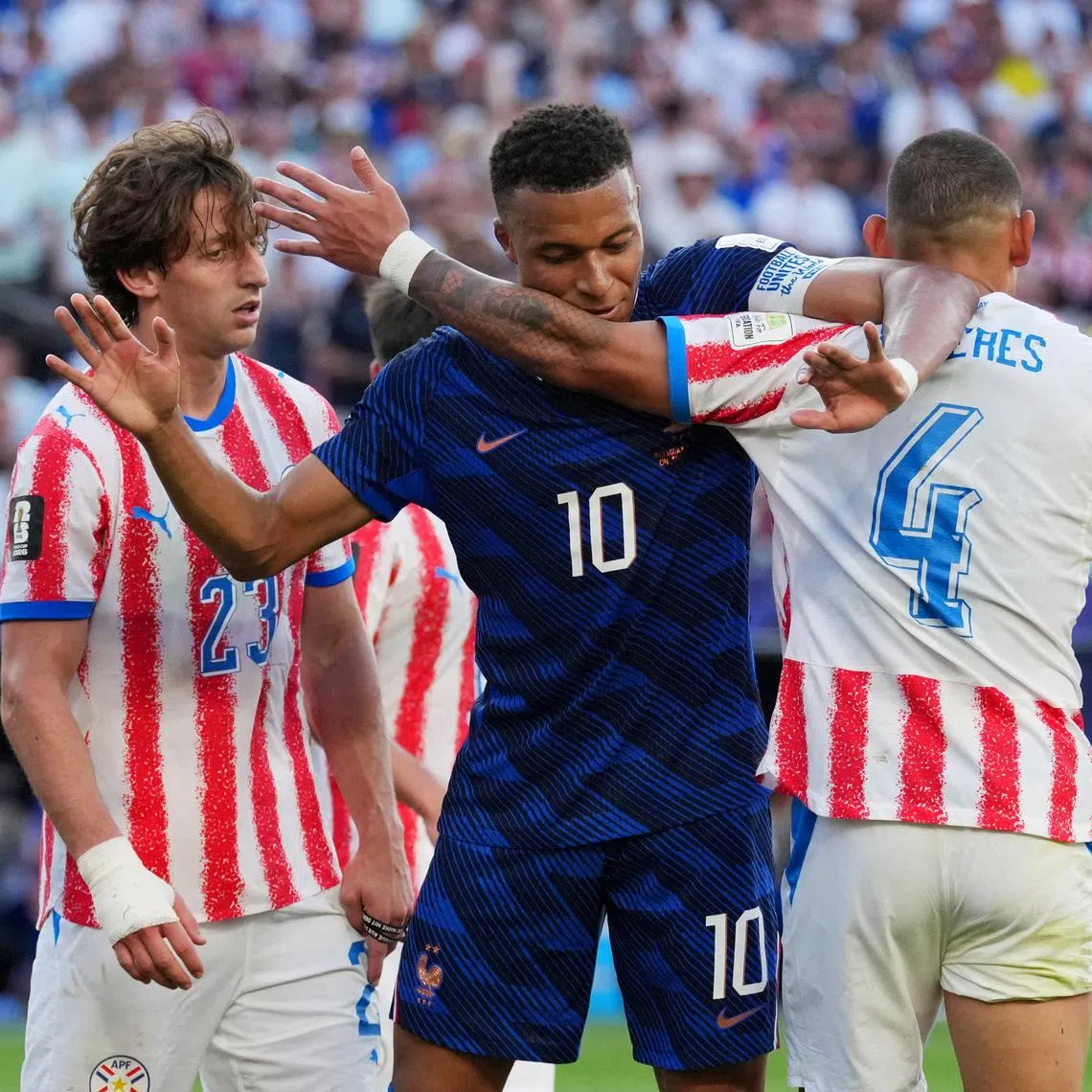 Soccer Football - FIFA World Cup 2026 - Round of 16 - Paraguay v France - Philadelphia Stadium, Philadelphia, Pennsylvania, U.S. - July 4, 2026 France's Kylian Mbappe reacts with Paraguay's Juan Jose Caceres IMAGN IMAGES via Reuters/James Lang
