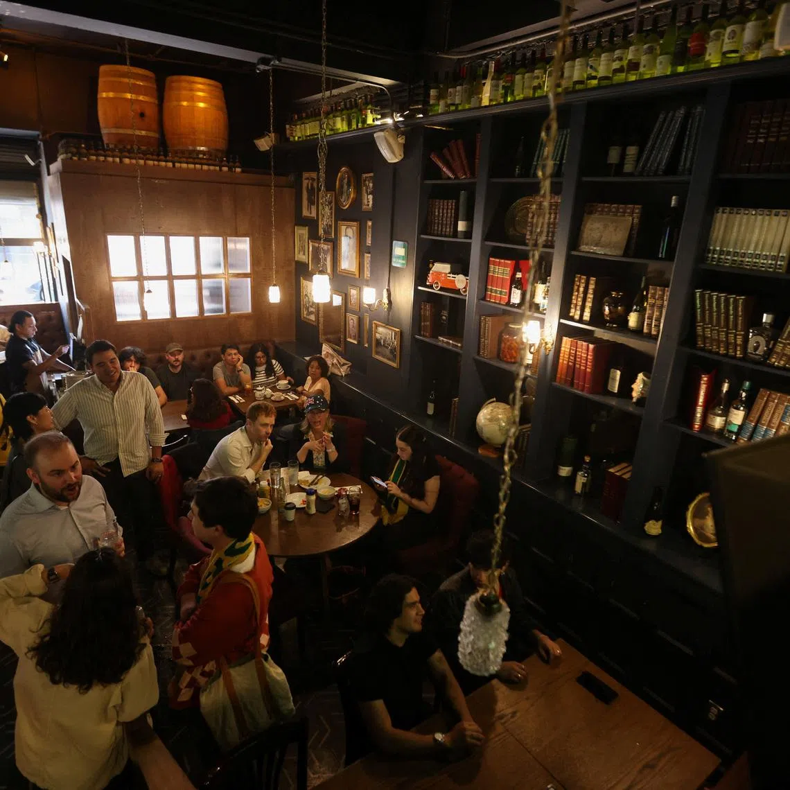 People watch a FIFA World Cup 2026 match at the Duke of Lisbon pub, a British-Mexican bar, that expects to see fans gather to watch the match between Mexico and England in the World Cup Round of 16, in Mexico City, Mexico, July 3, 2026. REUTERS/Quetzalli Nicte-Ha