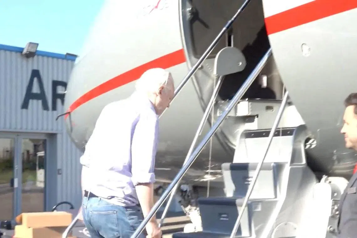 WikiLeaks founder Julian Assange boards a plane at a location given as London, Britain, in this still image from video released JUNE 25, 2024.  \"@wikileaks\" via X/Handout via REUTERS