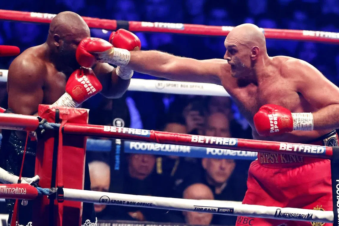 Tyson Fury landing a punch against fellow Briton Derek Chisora during their WBC heavyweight title fight on Saturday.