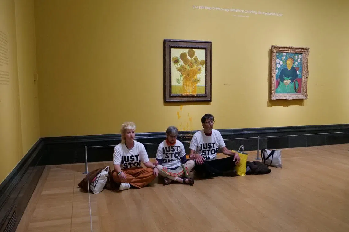 Three people were arrested after throwing soup at two of Vincent van Gogh's "Sunflowers" paintings in London's National Gallery on Sept 27.