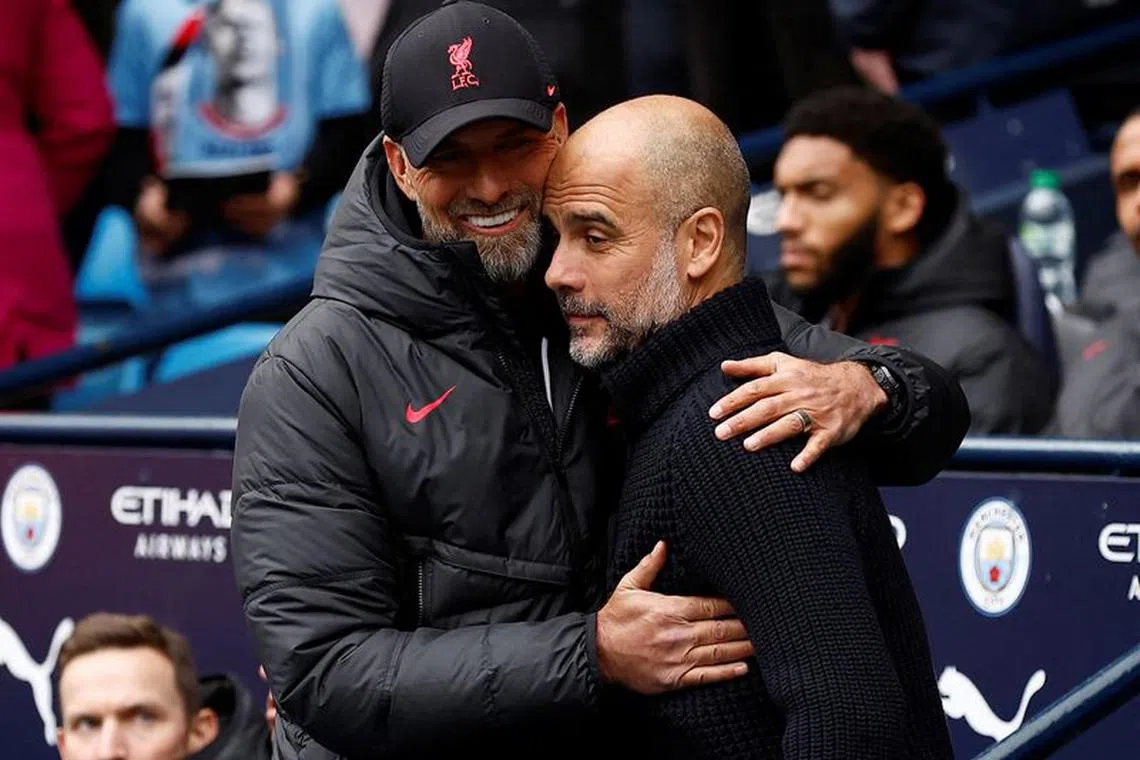 FILE PHOTO: Soccer Football - Premier League - Manchester City v Liverpool - Etihad Stadium, Manchester, Britain - April 1, 2023  Manchester City manager Pep Guardiola with Liverpool manager Juergen Klopp before the match Action Images via Reuters/Jason Cairnduff/File Photo