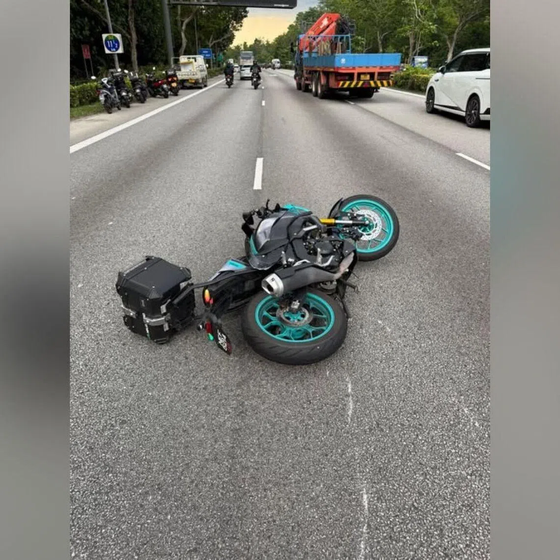 Scratch marks can be seen near the toppled motorcycle.