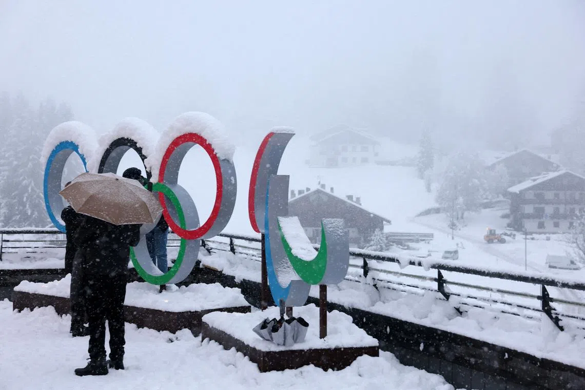 Milano Cortina 2026 Winter Olympics - Previews - Cortina d'Ampezzo, Italy - January 25, 2026 General view of the Olympic rings and the Paralympics Agitos logo covered in snow ahead of the Milano Cortina 2026 Winter Olympics REUTERS/Claudia Greco