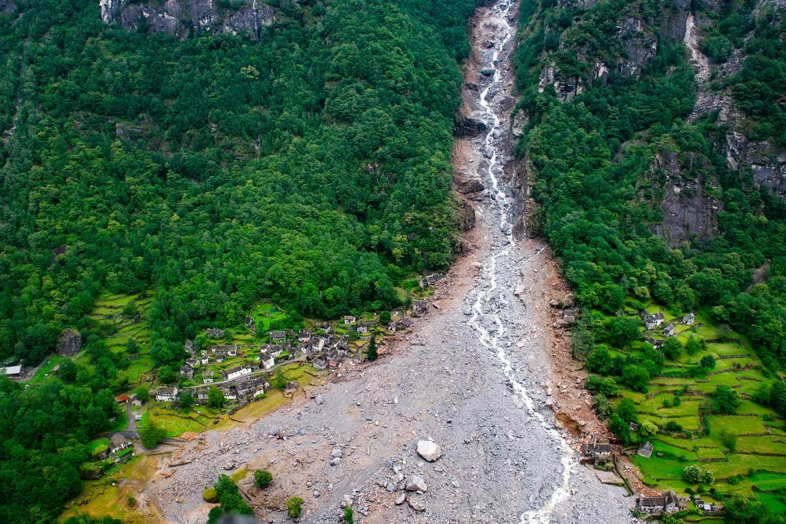 An aerial view shows destroyed houses in Fontana, in the Maggia Valley on June 30.