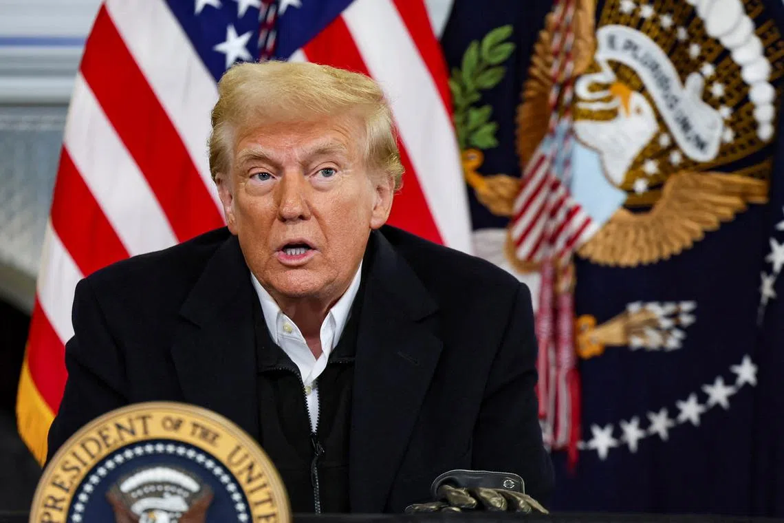 U.S. President Donald Trump speaks during a disaster briefing at a hanger, as he visits to assess recovery efforts and tour areas devastated by Hurricane Helene, at Asheville Regional Airport in Asheville, North Carolina, U.S., January 24, 2025. REUTERS/Leah Millis