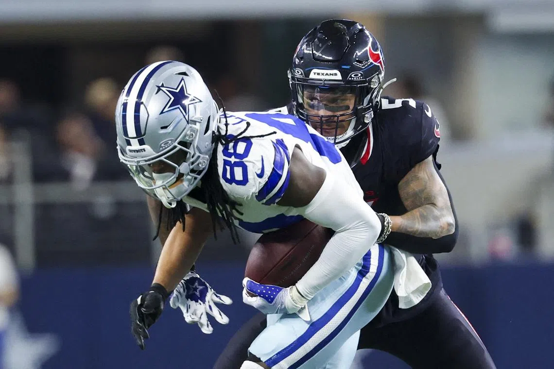 Nov 18, 2024; Arlington, Texas, USA;  Dallas Cowboys wide receiver CeeDee Lamb (88) runs with the ball as Houston Texans safety Jalen Pitre (5) defends during the first half at AT&T Stadium. Mandatory Credit: Kevin Jairaj-Imagn Images/File Photo