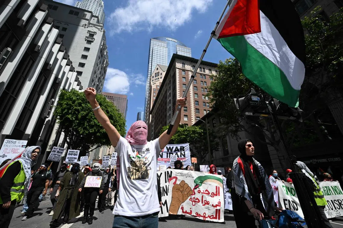 Demonstrators rally during a 'Strike for Gaza' protest calling for a permanent ceasfire in the Israel-Hamas conflict on April 15, 2024, in Los Angeles, California. (Photo by Robyn BECK / AFP)