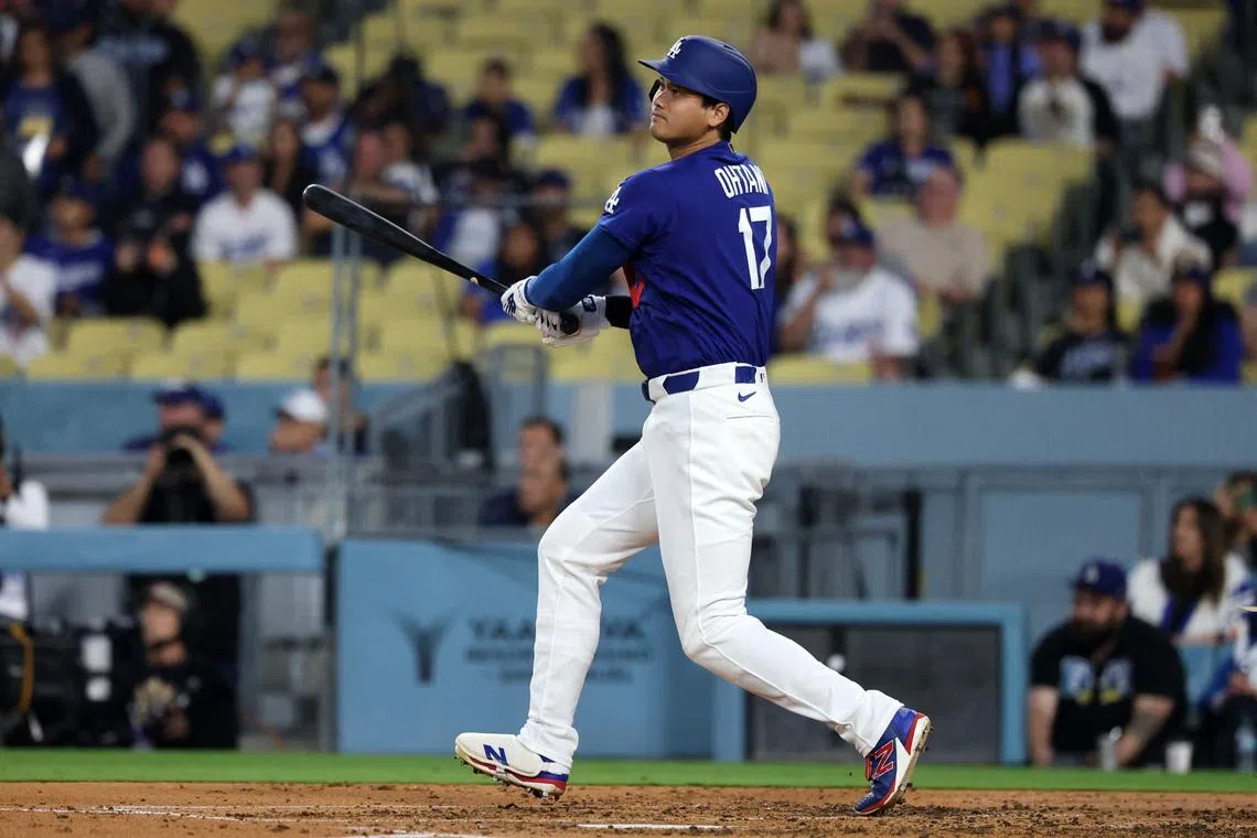 Mar 23, 2026; Los Angeles, California, USA;  Los Angeles Dodgers designated hitter Shohei Ohtani (17) hits a double during the third inning against the Los Angeles Angels at Dodger Stadium. Mandatory Credit: Kiyoshi Mio-Imagn Images