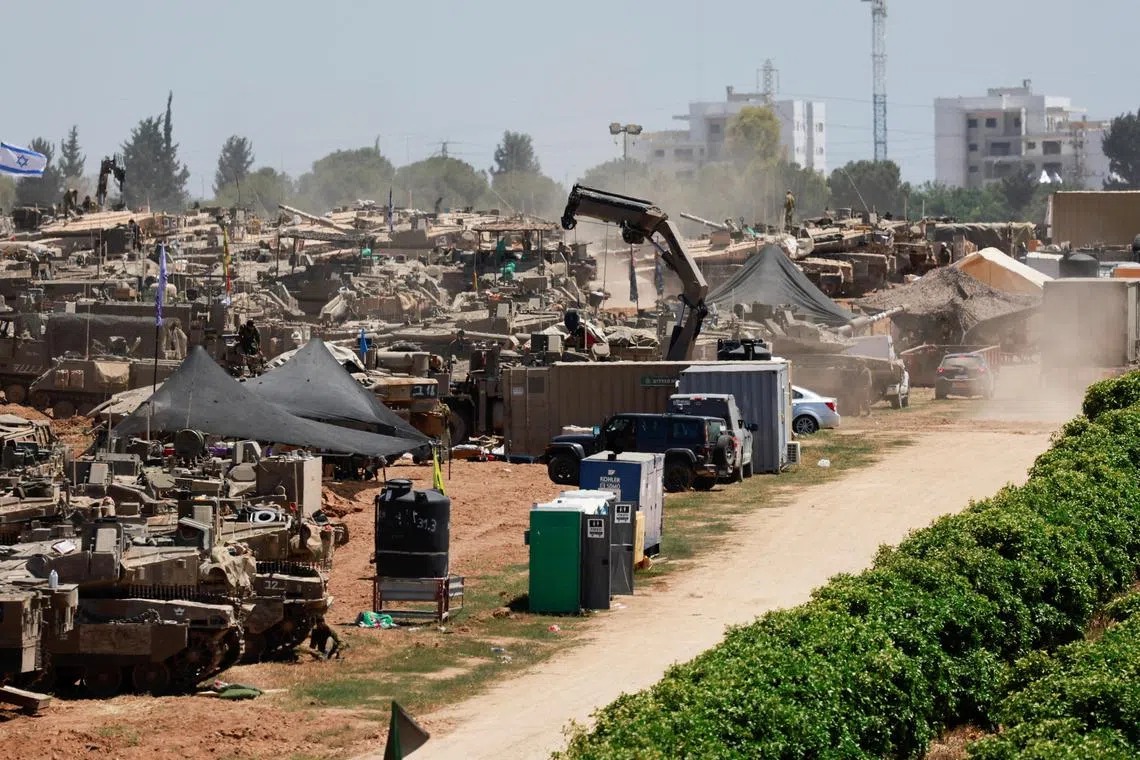 Israeli military vehicles are seen near the Israel-Gaza border, amid the ongoing conflict between Israel and Hamas.