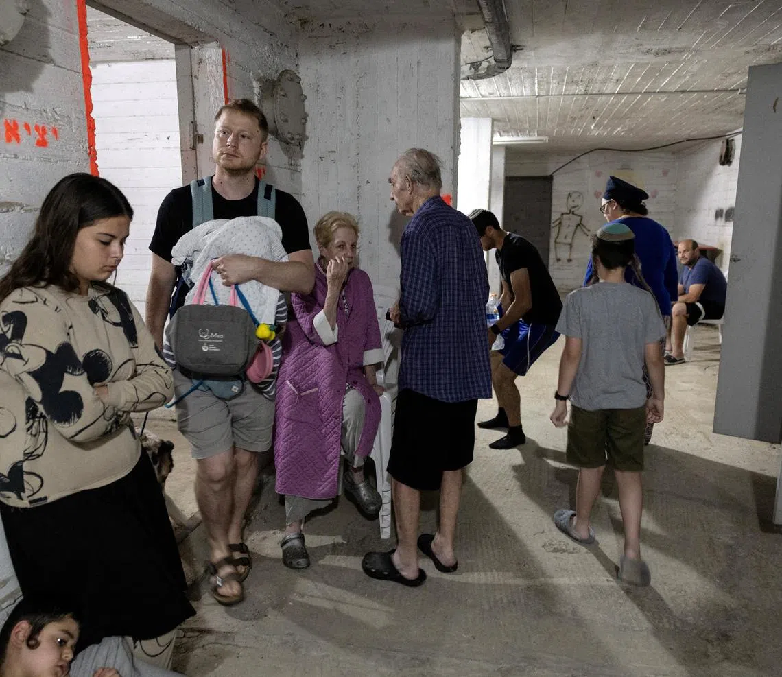 Israelis gather in a shelter following sirens in Tel Aviv, Israel June 13, 2025 REUTERS/Itay Cohen     TPX IMAGES OF THE DAY