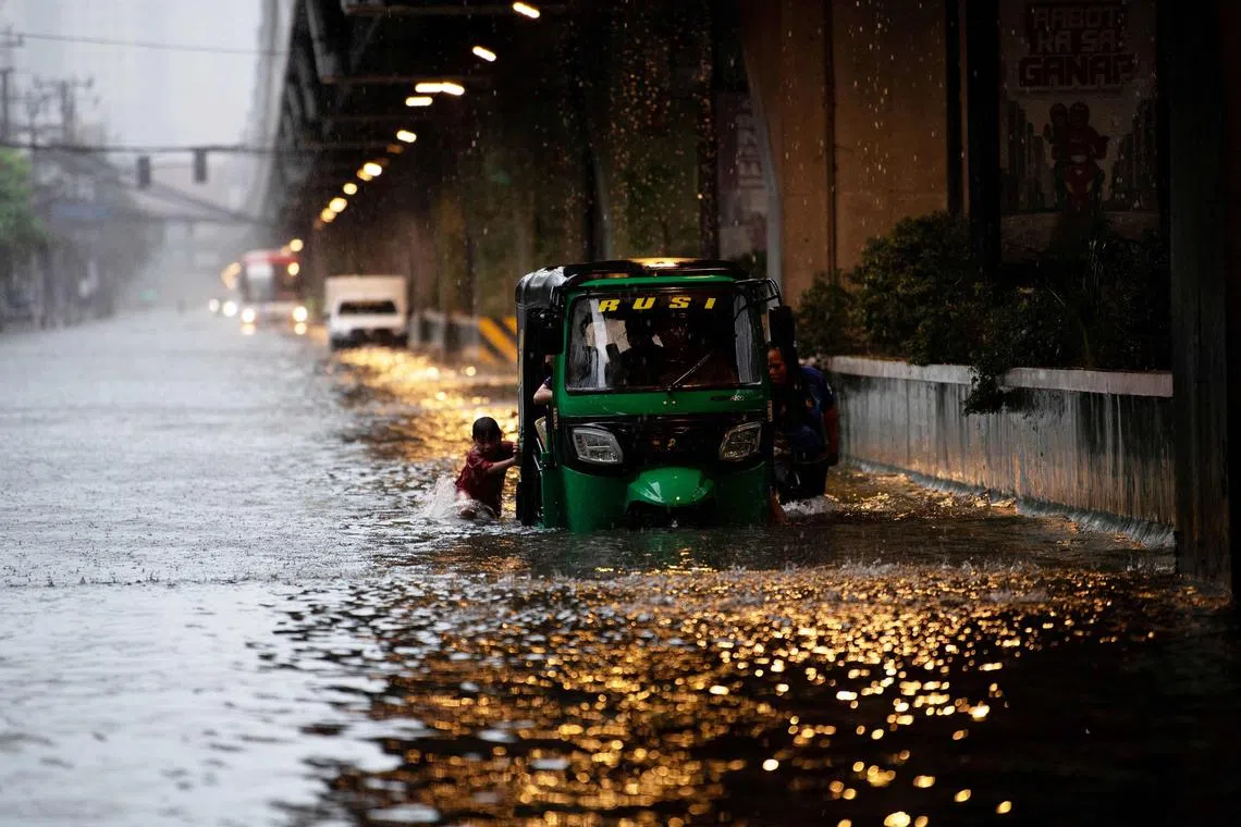 Life in metropolitan Manila ground to a halt on July 21 as torrential rains inundated the capital region.