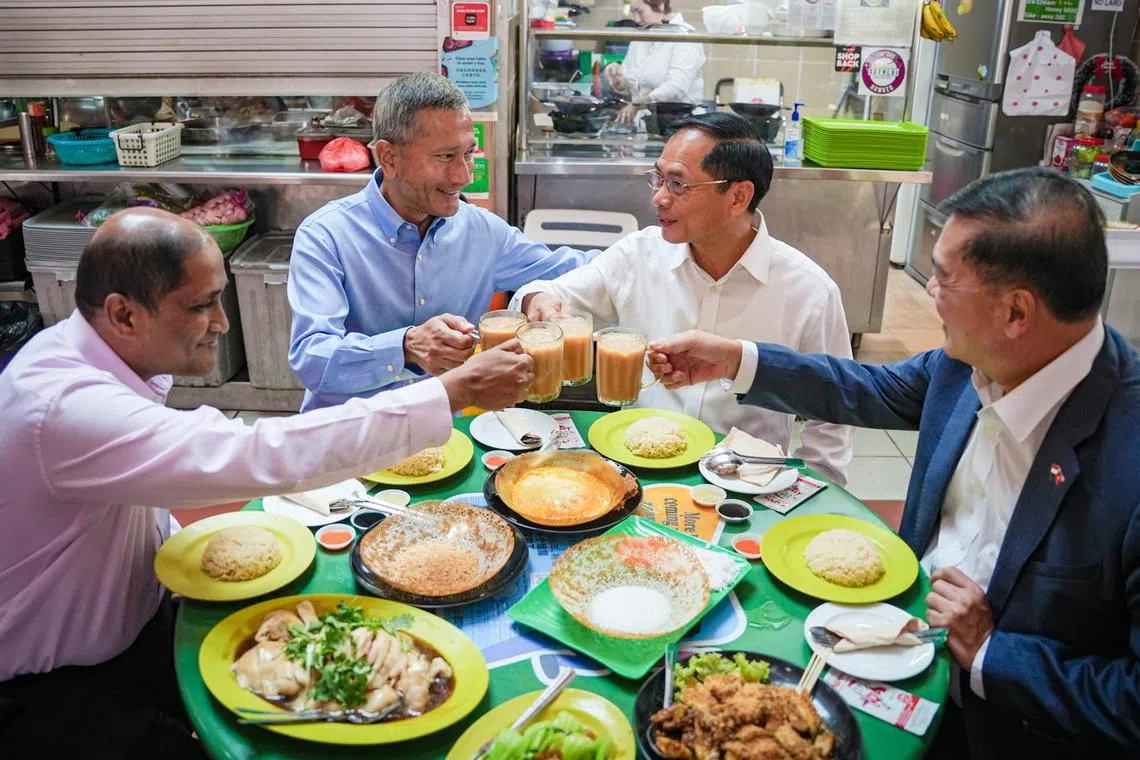From left: Mr Jaya Ratnam, Singapore's Ambassador to Vietnam, Minister for Foreign Affairs Dr Vivian Balakrishnan, Vietnam Minister of Foreign Affairs Bui Thanh Son and Vietnam's ambassador to Singapore Mai Phuoc Dung at Maxwell Food Centre on Tuesday (18 July 2023).
