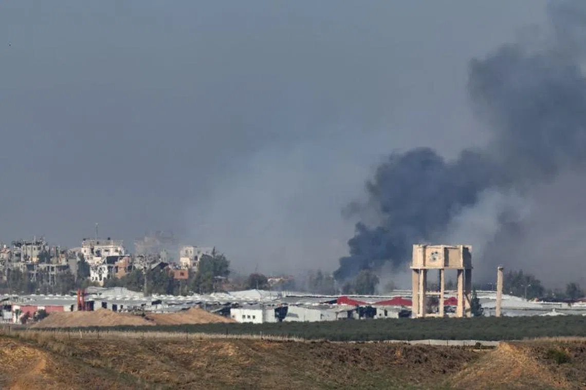 Smoke rises above Gaza, amid the ongoing conflict between Israel and the Palestinian Islamist group Hamas, as seen from southern Israel, December 4, 2023. REUTERS/Athit Perawongmetha