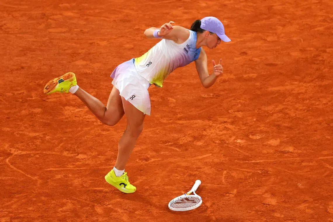 Poland's Iga Swiatek drops her racket during her semi-final match against Belarus' Aryna Sabalenka during the French Open held at Roland Garros, Paris, France, on June 5, 2025.