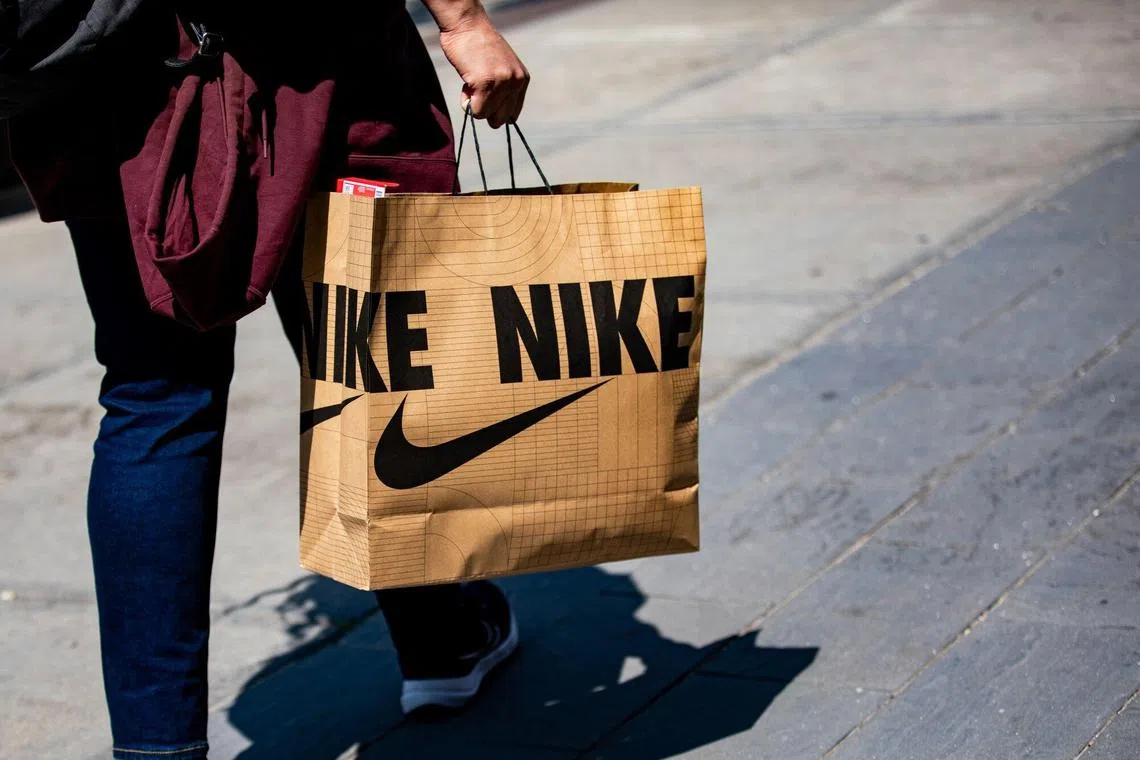 A shopper carries a Nike bag in downtown Detroit, Michigan, US, on Saturday, June 7, 2025. The Bureau of Labor Statistics is scheduled to release US consumer price index (CPI) figures on June 11. Photographer: Emily Elconin/Bloomberg