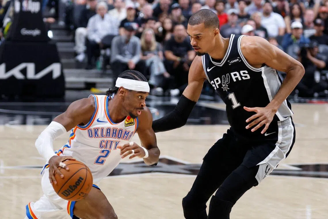 Shai Gilgeous-Alexander of the Oklahoma City Thunder driving against the San Antonio Spurs' Victor Wembanyama during the Spurs' 118-91 win in Game 6 of the NBA Western Conference Finals on May 28, 2026.