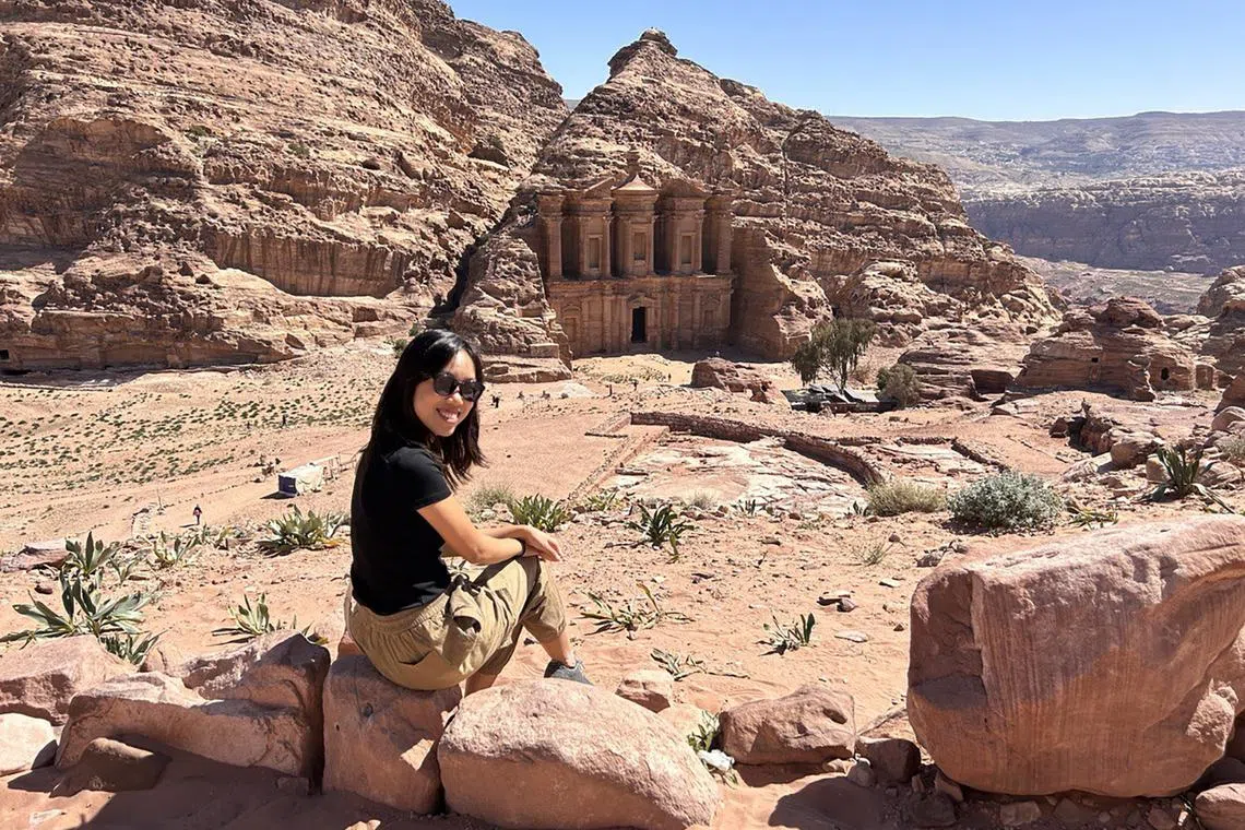 The writer taking a hard-earned break after a 900-step hike up to Petra’s Monastery. 