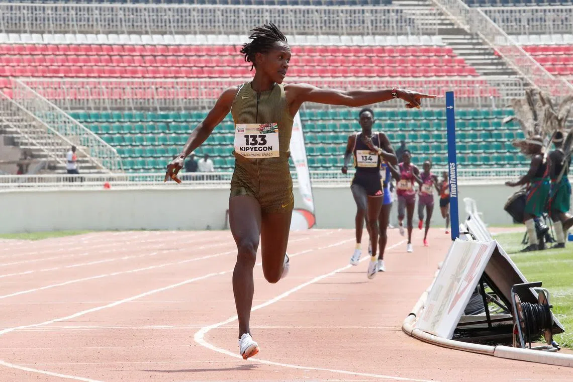 Athletics - Paris 2024 Olympic Trials - Women's 1500m Final - Nairobi, Kenya - June 15, 2024 - Kenyan 1500m world record holder Faith Kipyegon reacts as she competes at the Nyayo National Stadium. REUTERS/Monicah Mwangi
