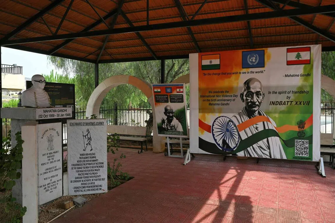 A poster shows the bust and memorial of Indian Leader Mahatma Gandhi in the southern Lebanese border village of Ibl Al Saqi on Oct 13.