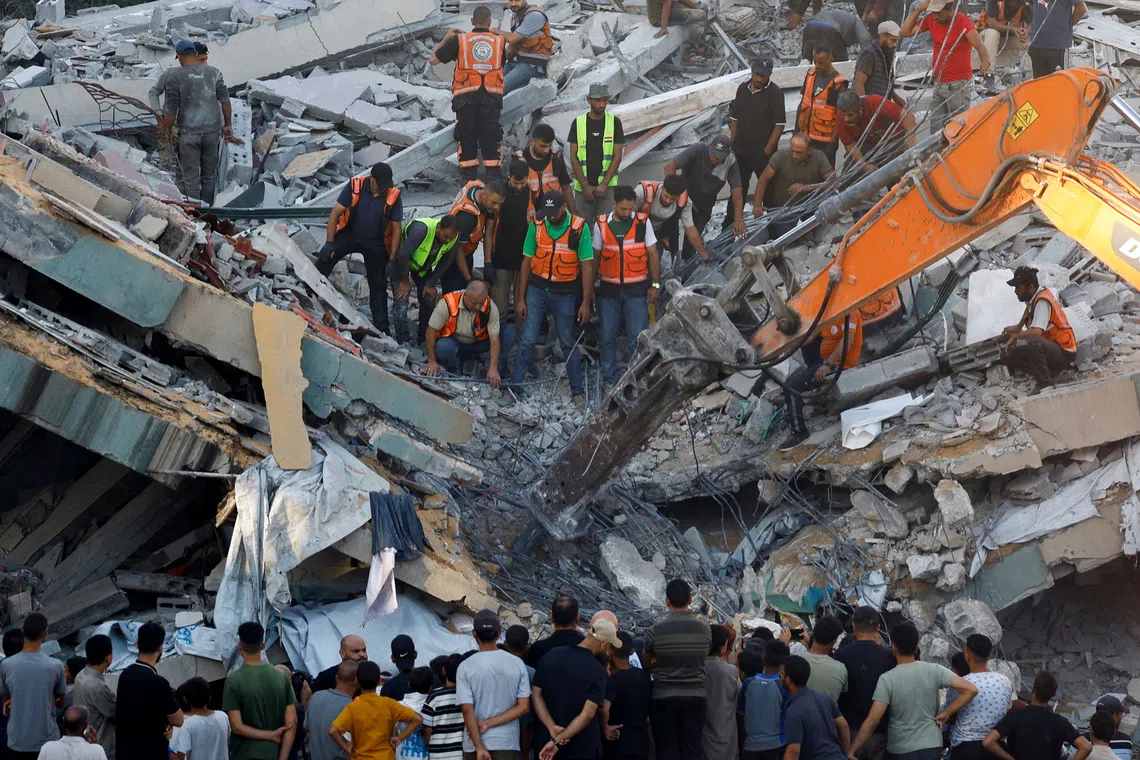 War-damaged Gaza building collapses killing 12 people seeking shelter inside