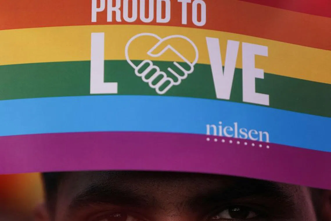 FILE PHOTO: A participant holds a banner during Queer Azadi Pride, an event promoting gay, lesbian, bisexual and transgender rights, in Mumbai, India, February 1, 2020. REUTERS/Francis Mascarenhas/File Photo