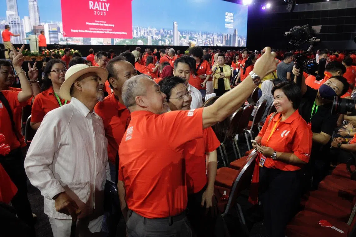 DPM Lawrence Wong taking a welfie with attendees at the May Day Rally 2023 at Suntec Singapore Convention & Exhibition Centre.