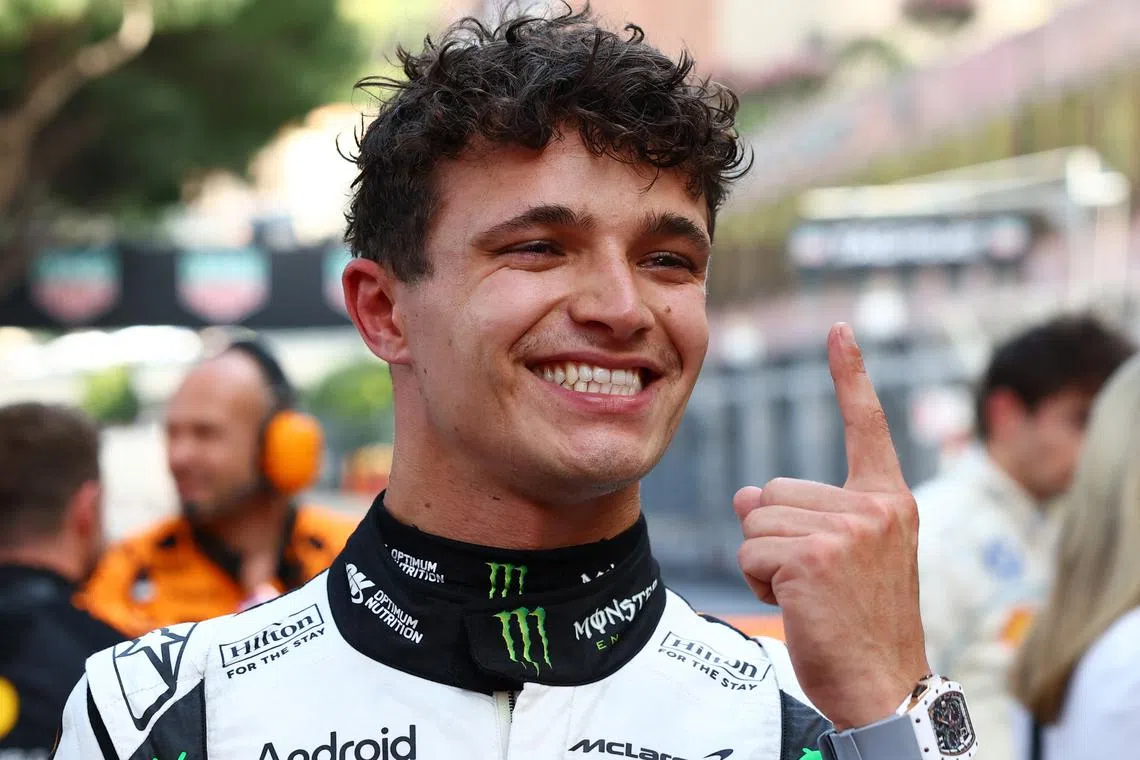 McLaren's Lando Norris celebrates after winning the Monaco Grand Prix on May 25.