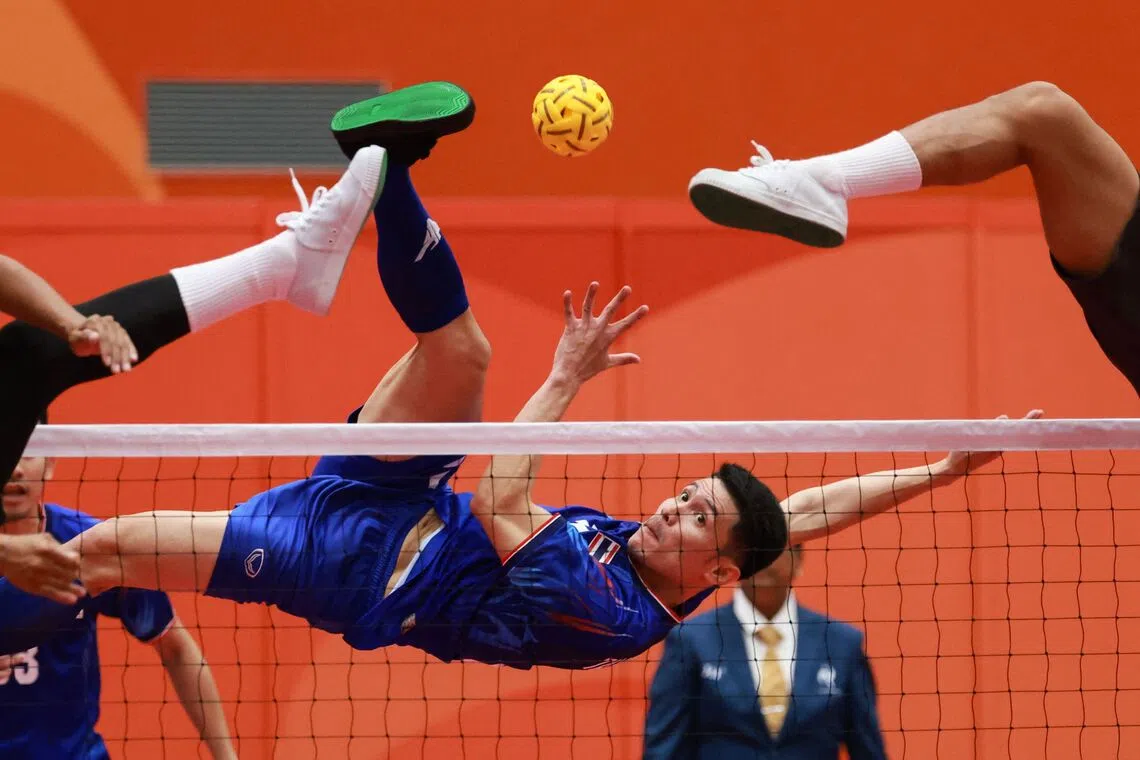 TOPSHOT - Thailand's Tanaphon Sapyen kicks the ball during the men's team regu sepak takraw match between Thailand and Indonesia at Nagoya City Mizuho Park Gymnasium in Nagoya on September 21, 2026. (Photo by DAVID GRAY / AFP)