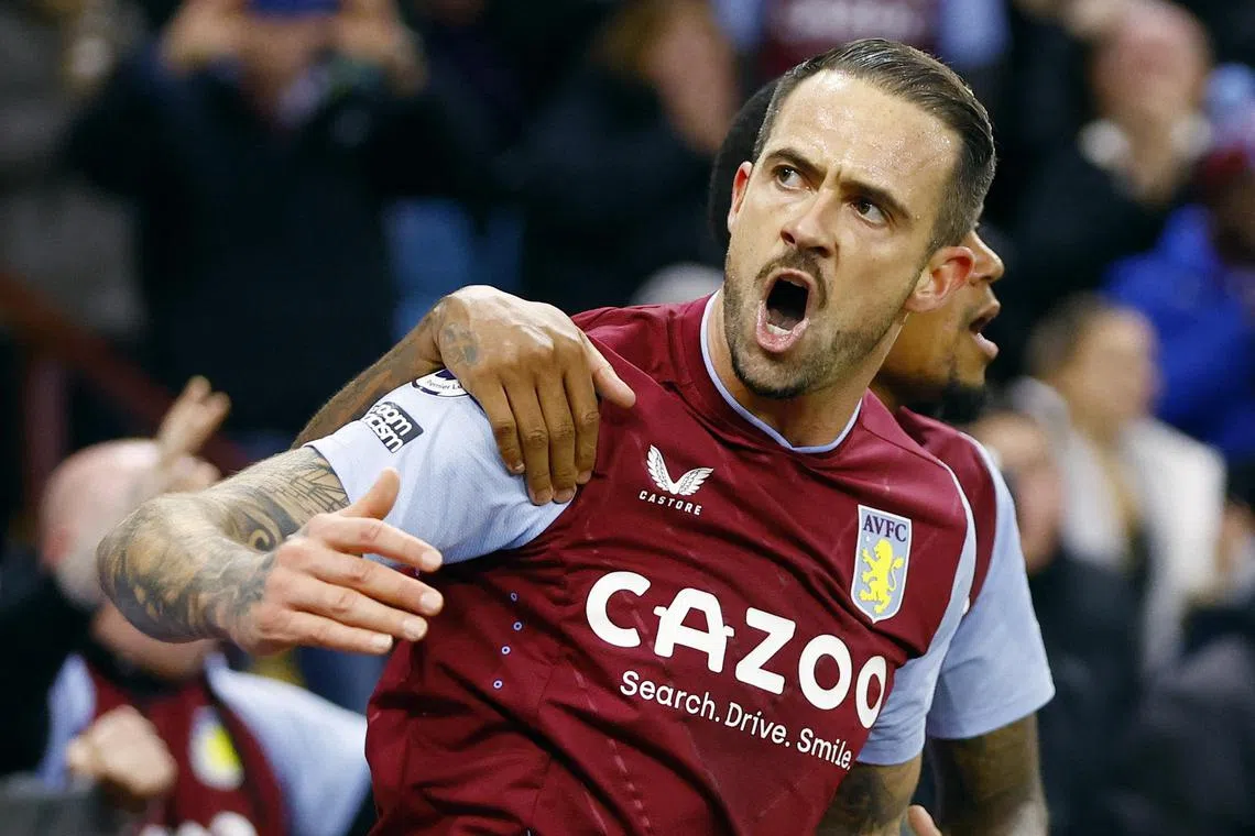 Aston Villa's Danny Ings celebrates scoring their first goal with Leon Bailey.