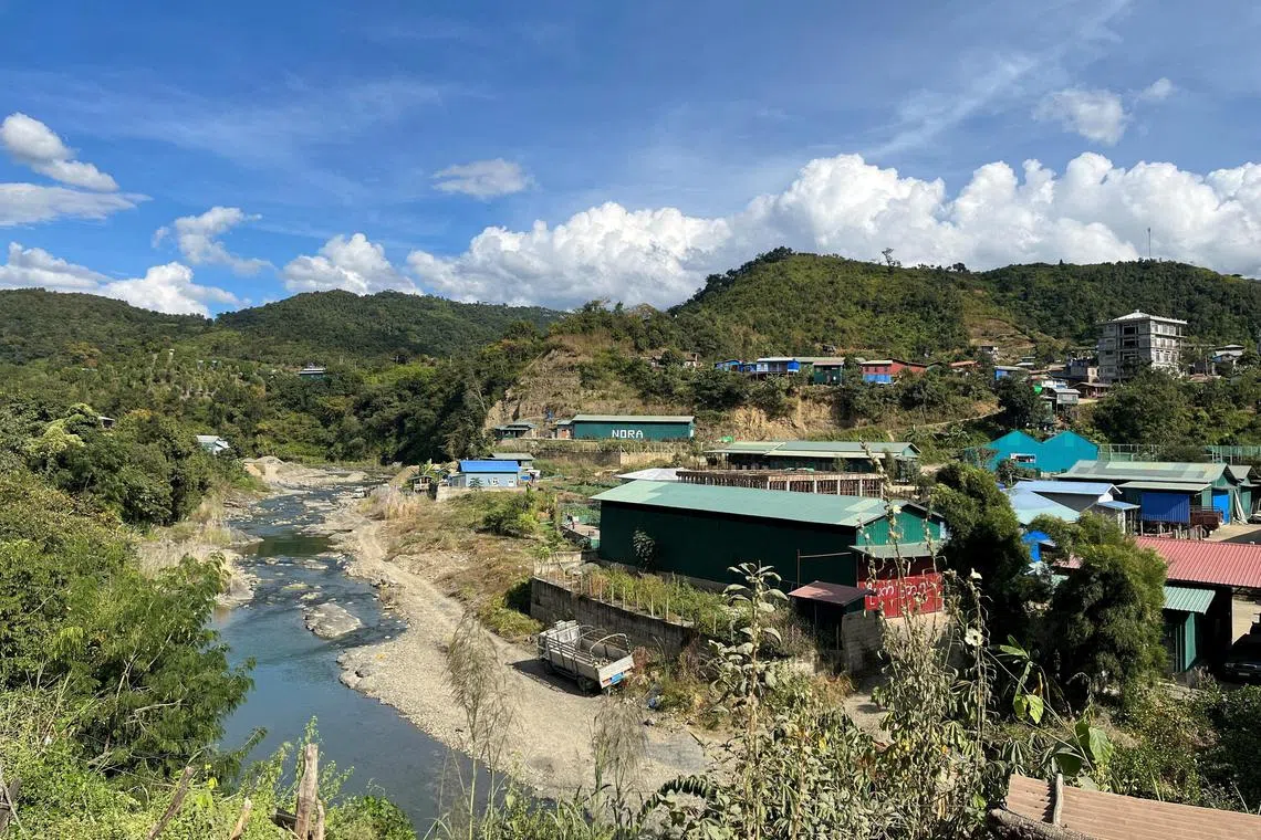 A view of Myanmar's Khawmawi village on the India-Myanmar border across the Tiau river, as seen from India's Zokhawthar village in Champhai, Mizoram.