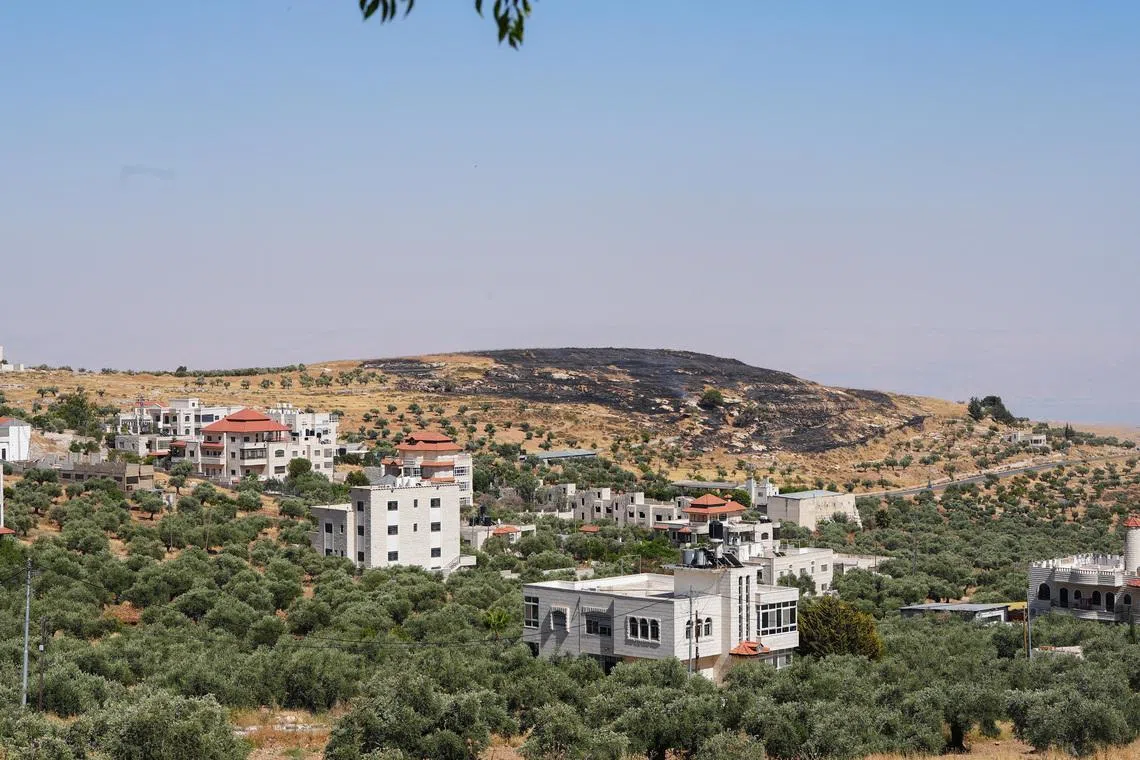 A burned hilltop near the Christian Taybeh village in the Israeli-occupied West Bank, June 10, 2026. REUTERS/Ali Sawafta