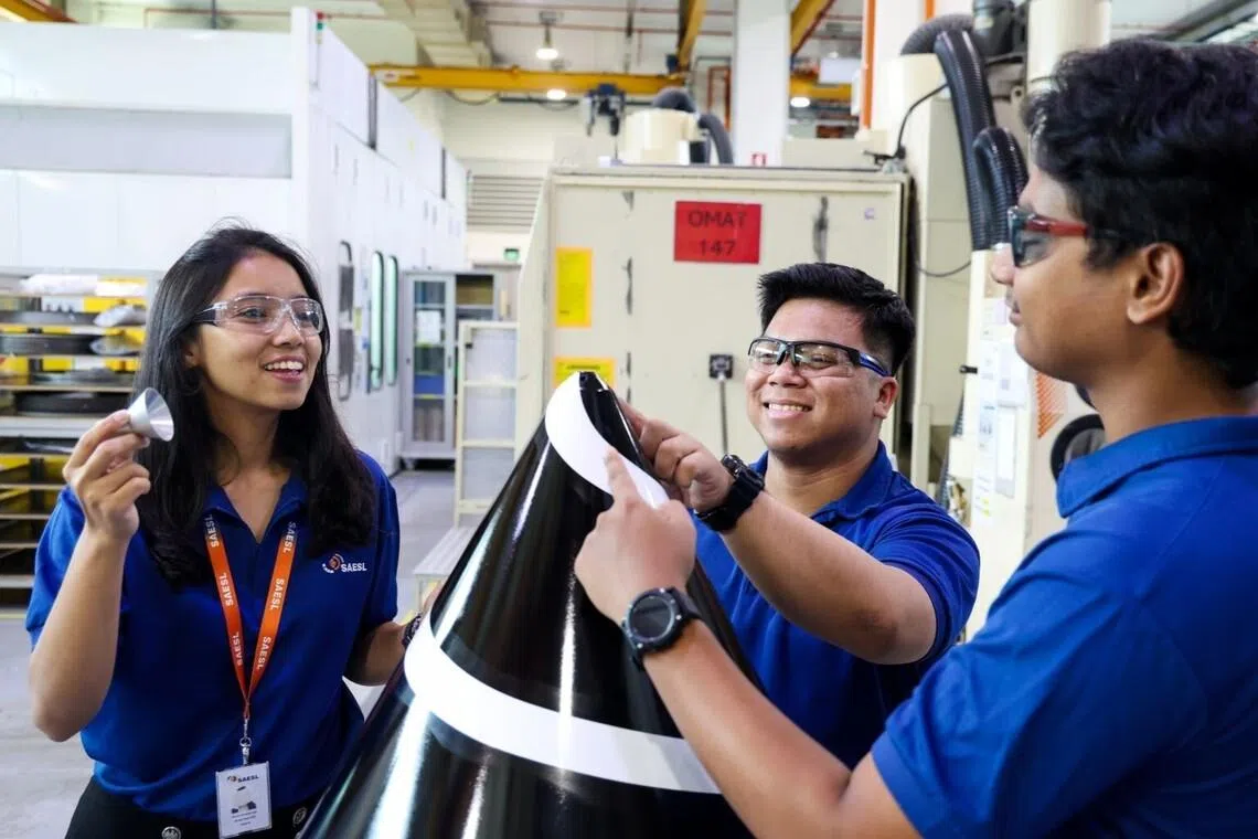 Ms Nurul Humairrak Abdullah (left) works with colleagues at SAESL to ensure the safety and reliability of millions of passenger journeys.