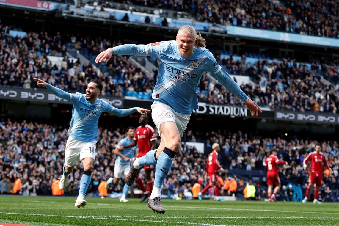 Soccer Football - FA Cup - Quarter Final - Manchester City v Liverpool - Etihad Stadium, Manchester, Britain - April 4, 2026 Manchester City's Erling Haaland celebrates scoring their first goal with Rayan Cherki Action Images via Reuters/Jason Cairnduff