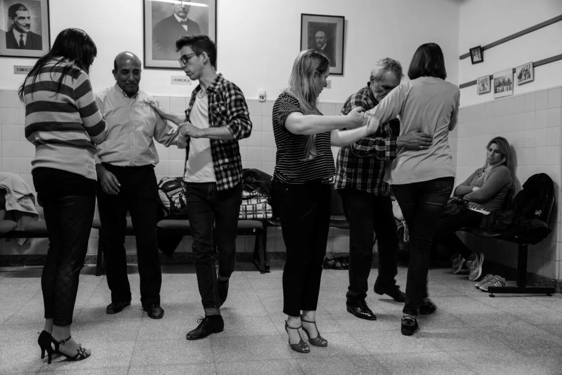 Manuel Firmani, centre left, is a professional tango dancer who leads the workshops, along with Veronica Litvak, centre right. 