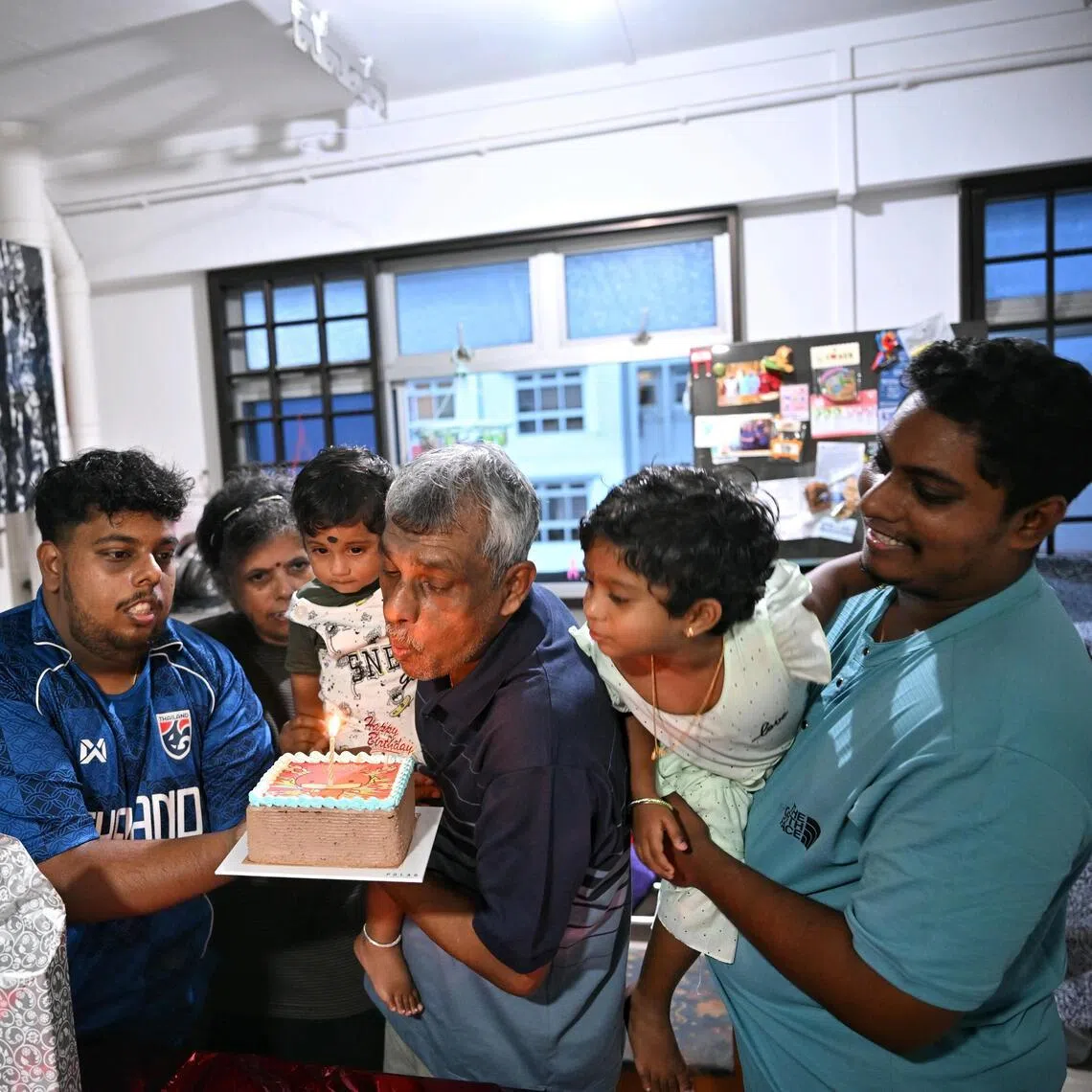 Karthigeyan (left) and and Shanger Pannerchelvam (right) are not only sons, but also protectors of their father, D. Pannerchelvam, who has intellectual disability. The family celebrated his 67th birthday in June.