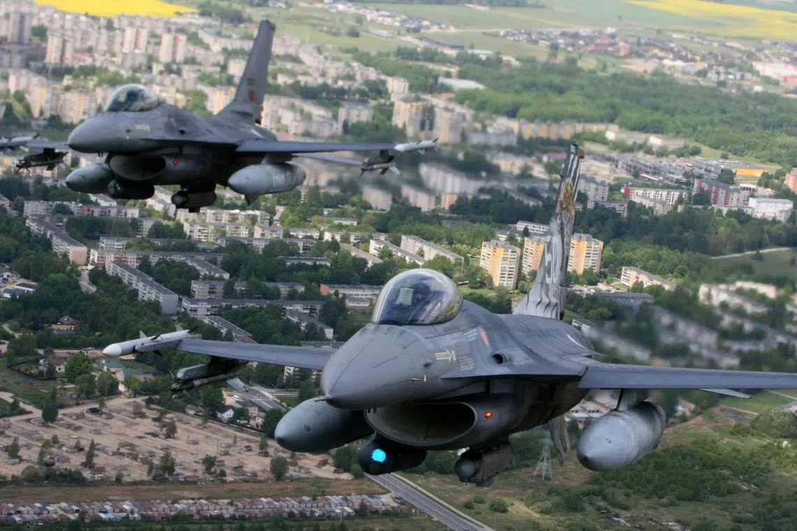 Portuguese Air Force F-16 military fighter jets participating in NATO's Baltic Air Policing Mission in Lithuanian airspace near Siauliai, on May 23.